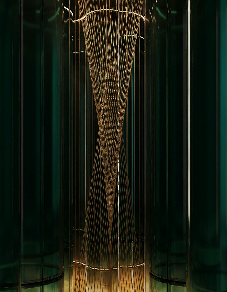 Golden light threads weaving upward through emerald glass