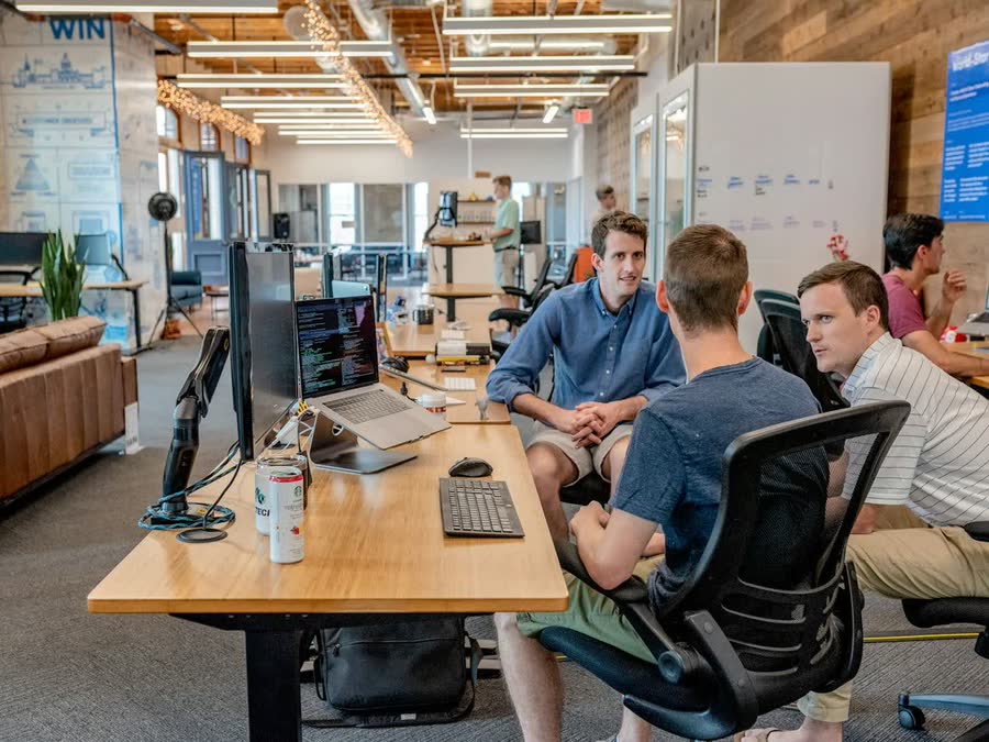 Colleagues planning work together in a modern meeting room